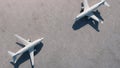 Two airplanes stand opposite at the airport. Aerial view.