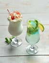 Two alcohol margarita martini cocktail and milkshake composition Royalty Free Stock Photo