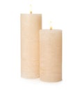 Two alight wax candles on white Royalty Free Stock Photo