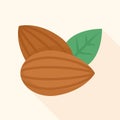 Two almond nuts with green leaf on cream background Royalty Free Stock Photo