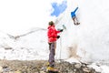 Two alpinists friends climbing ice glacier wall mountain Andes Peru