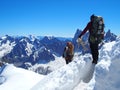 Two alpinists and mountaineer climber on Aiguille du Midi