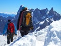 Two alpinists and mountaineer climber on Aiguille du Midi