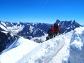 Two alpinists and mountaineer climber on Aiguille du Midi