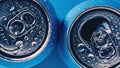 Two aluminum beer cans on blue background with water drops Royalty Free Stock Photo