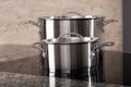 Two aluminum pots on induction hob Royalty Free Stock Photo