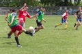 Two amateur football teams play on the field in