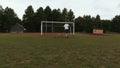 Two amateurs playing soccer on football field