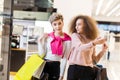 Young woman showing something in the shop window to her husband Royalty Free Stock Photo