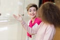 Young woman showing something in the shop window to her husband Royalty Free Stock Photo