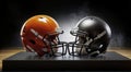Two American football helmets facing each other on a black background with smoke Royalty Free Stock Photo