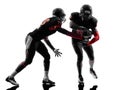 Two american football players passing play action silhouette