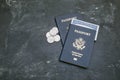 Two American passports and social security card on black background