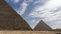 Two ancient Egyptian pyramids: Cheops and Chephren on a background of blue sky