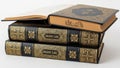 Two ancient lore books stacked, isolated on white background Royalty Free Stock Photo