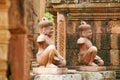 Two ancient stone statues from the Angkor Wat temple in Cambodia Royalty Free Stock Photo