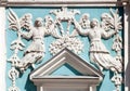 Two angels holding a crown: Baroque stucco molding on the facade of bell tower of St. Sophia Cathedral in Kyiv Royalty Free Stock Photo