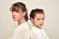 Two angry sisters standing back to back Royalty Free Stock Photo