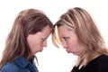 Two angry woman faces each other Royalty Free Stock Photo
