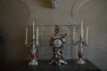 Two antique candlesticks and one old clock Royalty Free Stock Photo
