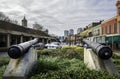 Two antique cannons pointing out towards Decatur Street in the French Quarter Royalty Free Stock Photo