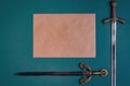 Two antique knightly swords and a sheet of old paper on a green velvet background.