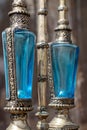 Two antique perfume bottles with blue cut crystal with a silver metal base Royalty Free Stock Photo