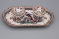 Two antique porcelain inkwells decorated with tray