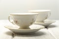 two antique teacups on white background