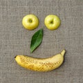 Two apple slices, green leaf and banana Royalty Free Stock Photo