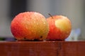 Two wet apples on a table Royalty Free Stock Photo