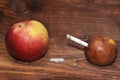 Two apples and a cigarette in wood background. smoke kills. No smok Royalty Free Stock Photo