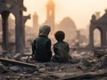 Two Arab children in dirty ragged clothes sit on the ruins of war-torn city against the backdrop of a collapsed mosque