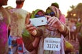 Two Arab women wearing Hijabs take an iPhone selfie at the Color Walk in Dubai, United Arab Emirates. Royalty Free Stock Photo