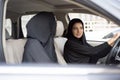 Two Arab Women Sitting in a Car, One is a Driver