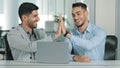 Two Arab young male businessmen sitting in modern office, satisfied with result of negotiations, having concluded