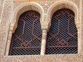 Two Arabian-style windows on the facade of the building decorated with Islamic patterns