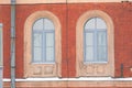 Two arched windows in a brick building Royalty Free Stock Photo