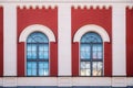 Two arched windows on a brick wall Royalty Free Stock Photo