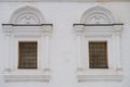 Two arched windows on a white stone wall, temple Royalty Free Stock Photo