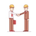 Two architects or building engineers shaking hands