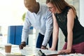 Two architects discussing a building design in an office Royalty Free Stock Photo