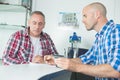 Two architects looking at blueprint working in office Royalty Free Stock Photo