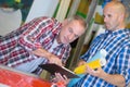 Two architects looking at clipboard working in office Royalty Free Stock Photo