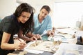 Two Architects Making Models In Office Together