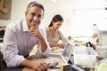 Two Architects Making Models In Office Using Digital Tablet Royalty Free Stock Photo