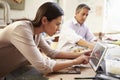 Two Architects Making Models In Office Using Digital Tablet Royalty Free Stock Photo