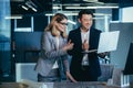 Two architects team, looking at camera and rejoicing smiling over completed project, keep thumbs up affirmatively Royalty Free Stock Photo