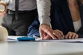 Two architects at work in their office with the man showing a bl Royalty Free Stock Photo