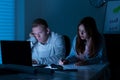 Two architects working at night